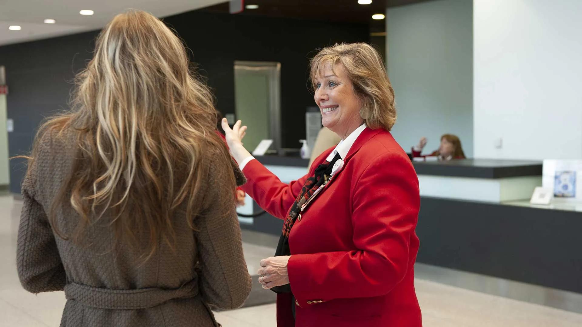Red Coat giving visitor directions