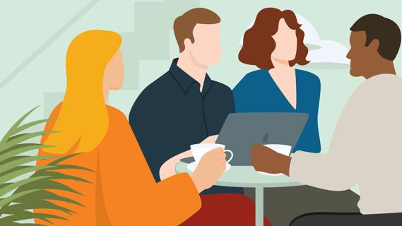 People sitting around small table, with coffee cups and a laptop