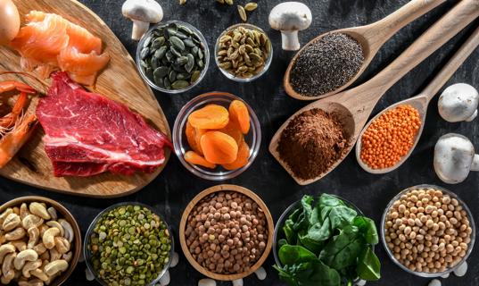 Assorted foods with zinc, like cashews, dried apricots and salmon